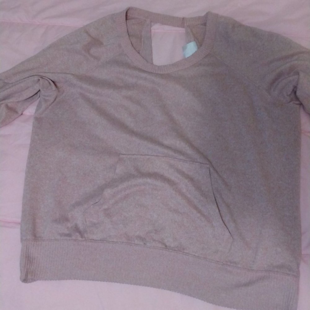 Light pink sweater with an open back